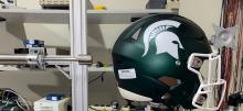 Michigan State Football helmet in a concussion testing lab